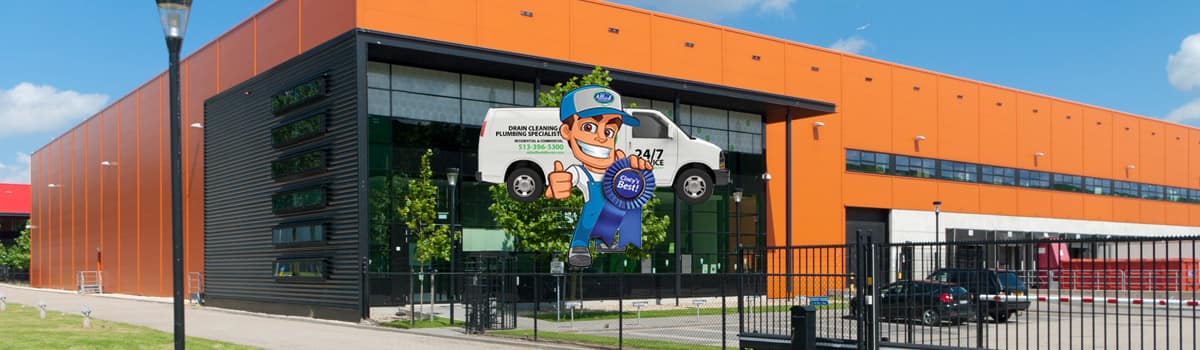 Commercial Plumbing repair image show plumbing truck in front of a commercial building